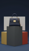 Bolso de diseñador en piel con herrajes dorados